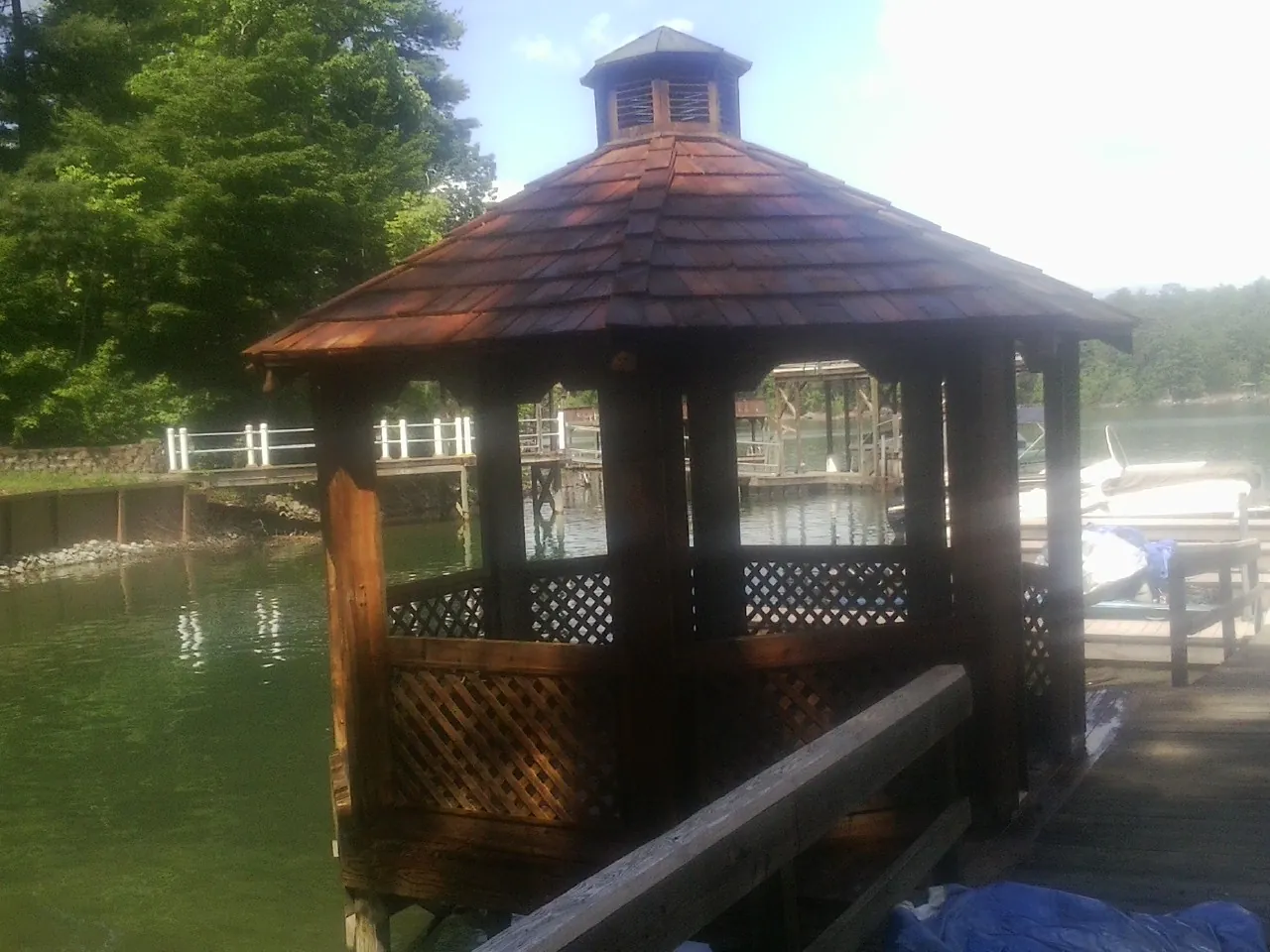 Cedar shake gazebo roof rebuilt on a lake dock in Chimney Rock